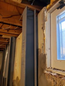 repairing damage basement window walls