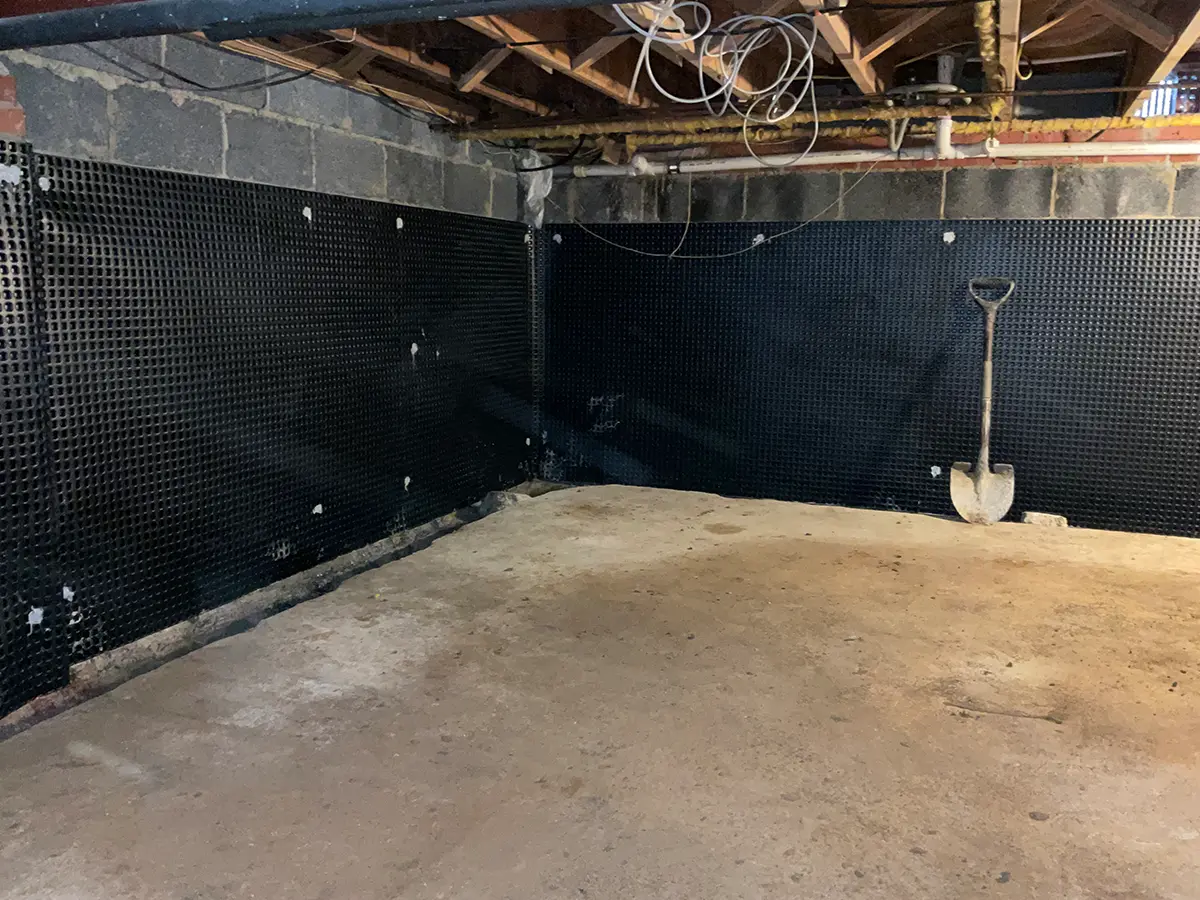 The concrete subfloor of an insulated basement