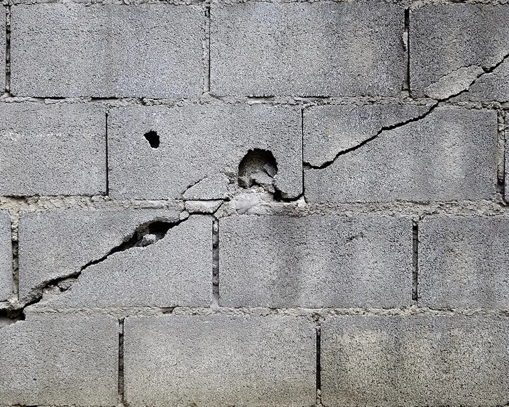 A large crack in the foundation of a basement wall