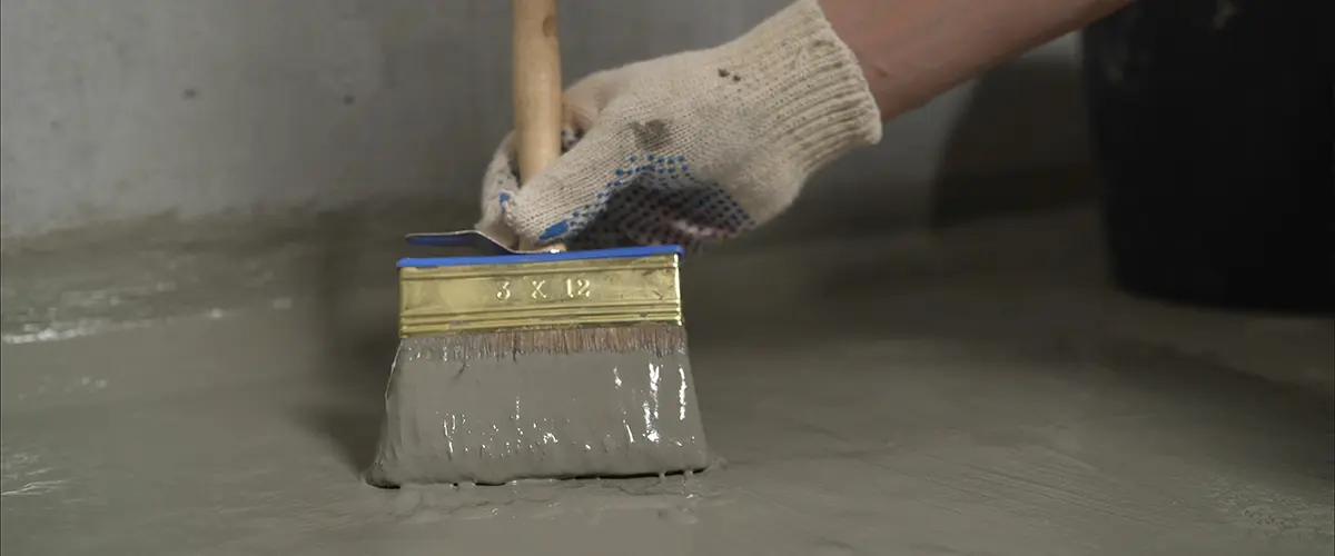 Concrete basement sealing applied with a smooth brush