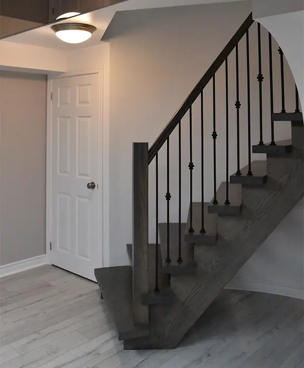 Basement remodeling in Hyattsville with LVP flooring and hardwood stairs