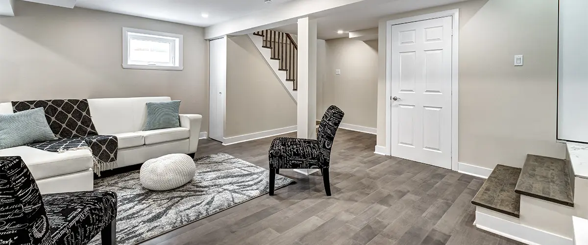 Living space in basement remodel with LVP flooring