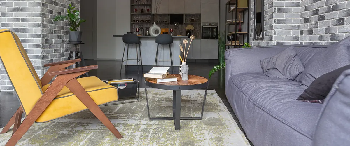 A small office with a couch and chairs in a basement