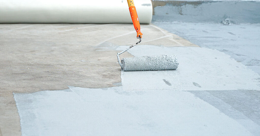 Hand painted gray flooring with paint rollers for waterproof