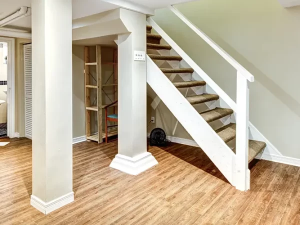 Living space with bedroom and half bath in a basement with LVP flooring